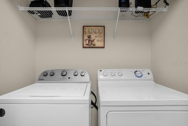 washroom featuring washer and dryer