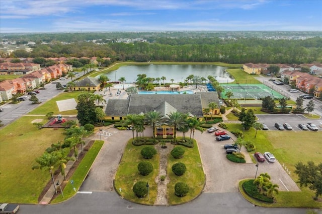 birds eye view of property with a water view