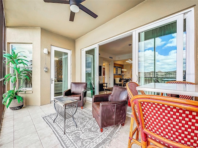 sunroom / solarium with ceiling fan