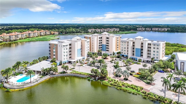 birds eye view of property with a water view