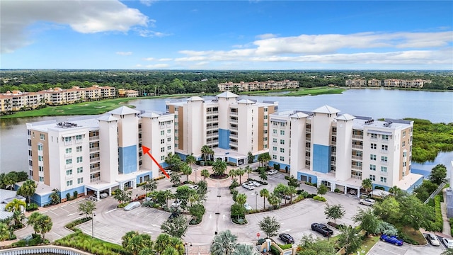 drone / aerial view with a water view