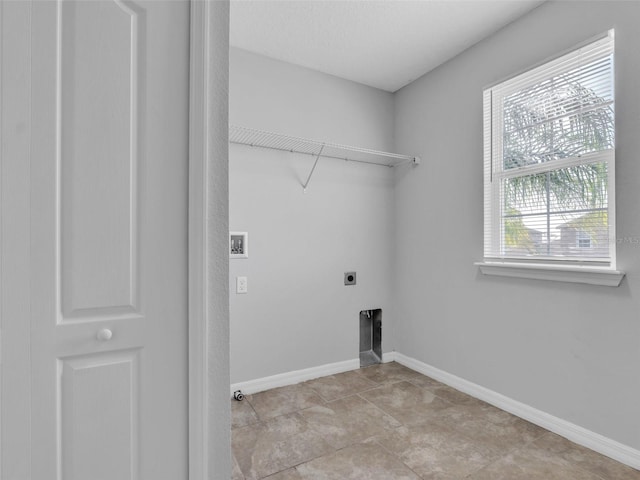 laundry area with baseboards, laundry area, washer hookup, and hookup for an electric dryer