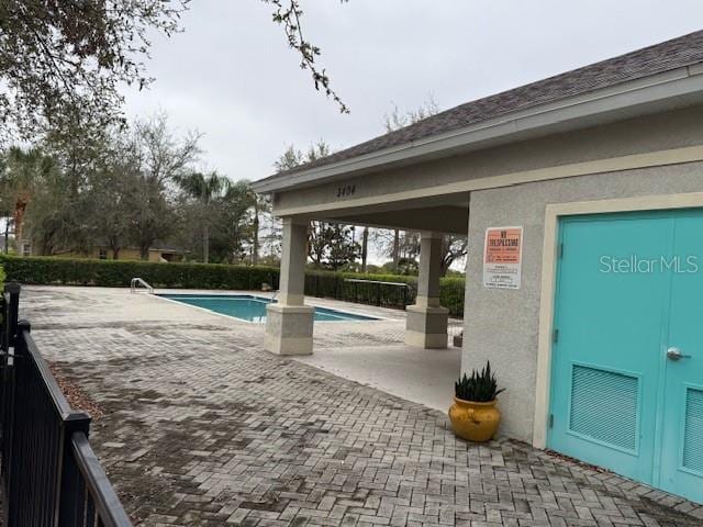 community pool featuring a patio area