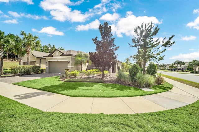 view of front facade with a garage and a front lawn