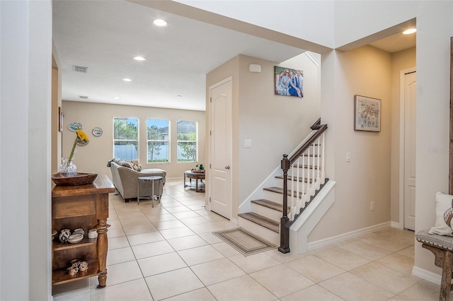 stairs with tile patterned floors