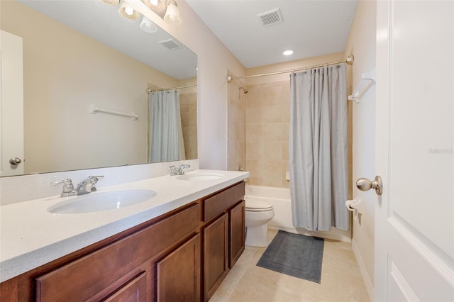 full bathroom with vanity, shower / bath combo, toilet, and tile patterned flooring