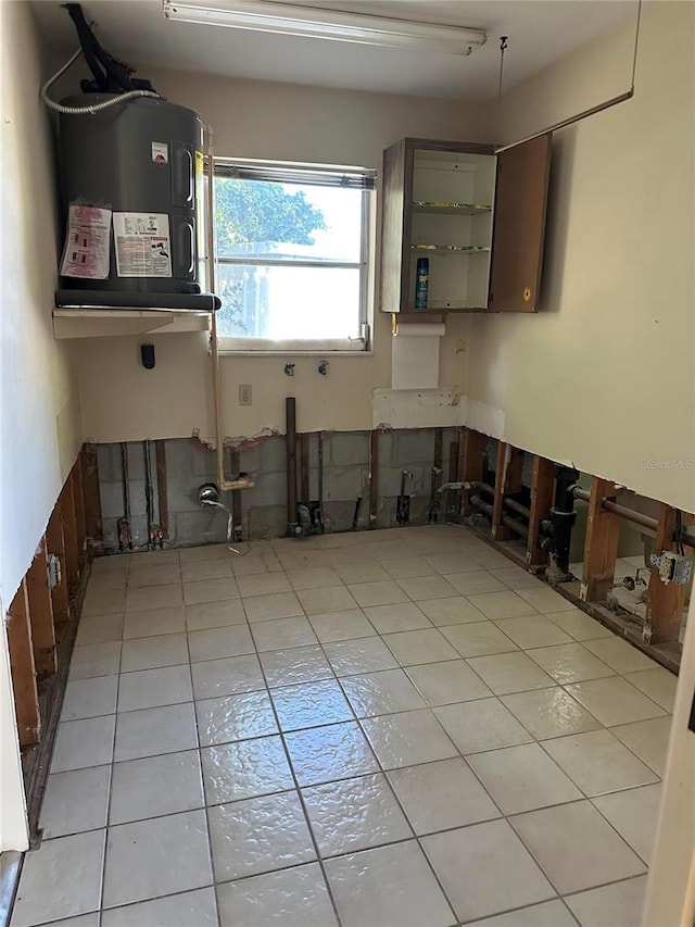 kitchen with dark brown cabinets and light tile patterned floors