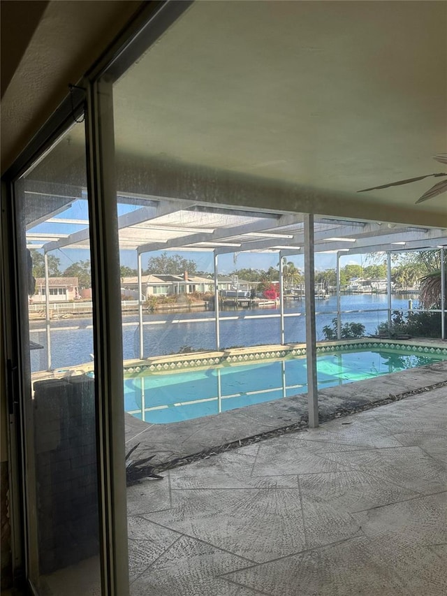 view of swimming pool with a water view