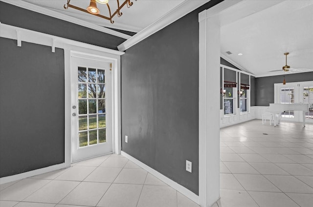 interior space with ceiling fan, ornamental molding, and vaulted ceiling