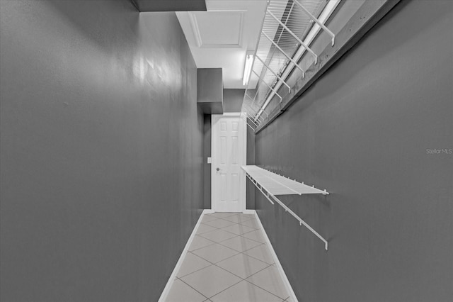 hallway featuring tile patterned flooring