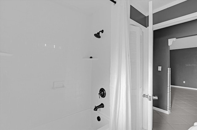 bathroom with tile patterned floors and shower / tub combo with curtain