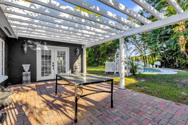 view of patio / terrace featuring a pergola and french doors