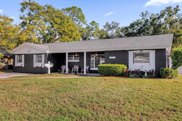 single story home with a porch and a front yard