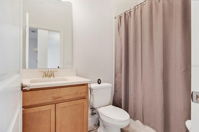 bathroom with toilet and vanity