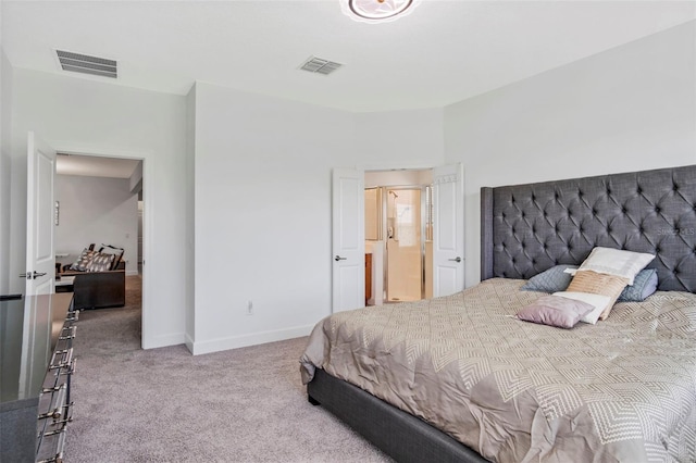 carpeted bedroom with visible vents and baseboards