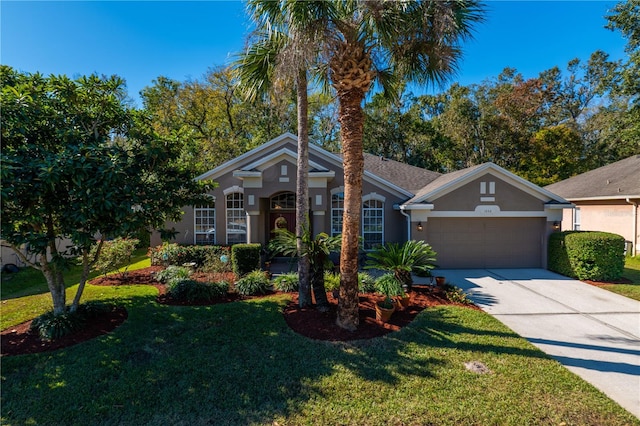 single story home with a front yard and a garage