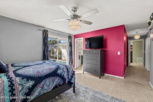 bedroom with access to outside, ceiling fan, and a textured ceiling