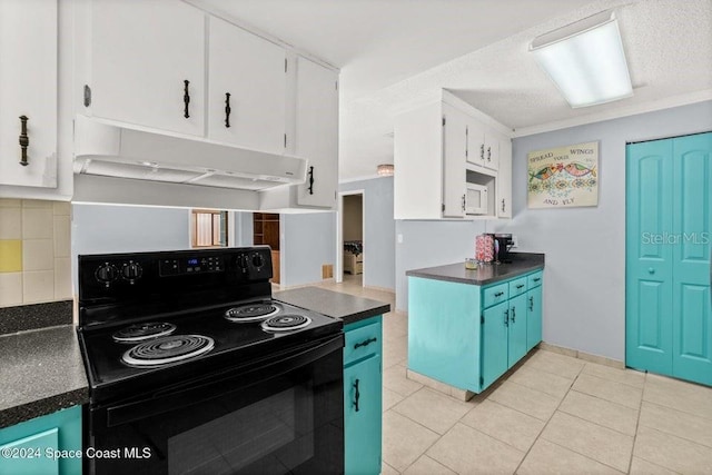 kitchen featuring black electric range, a textured ceiling, white cabinets, decorative backsplash, and light tile patterned floors