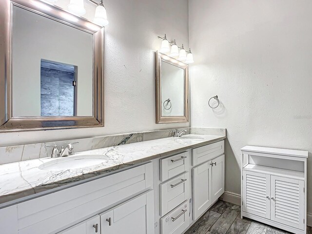 bathroom featuring hardwood / wood-style floors and vanity