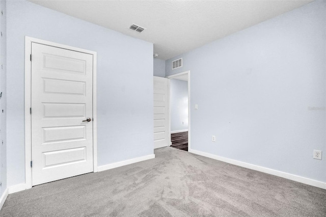 unfurnished bedroom featuring carpet