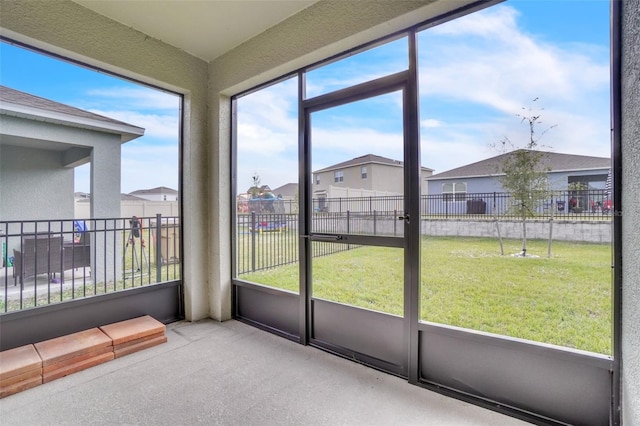 unfurnished sunroom featuring a healthy amount of sunlight