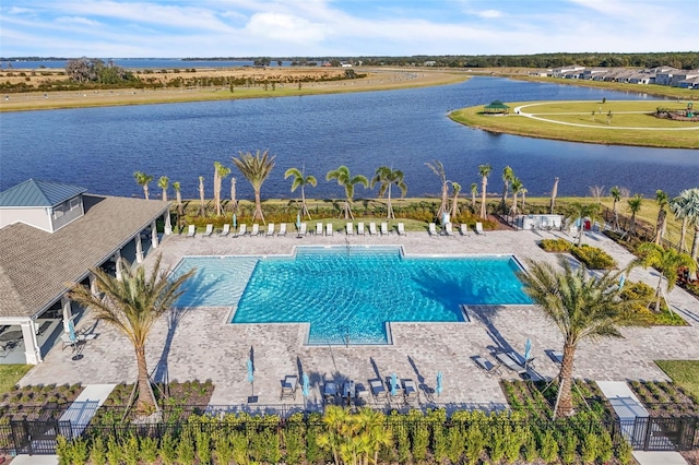 view of pool with a water view