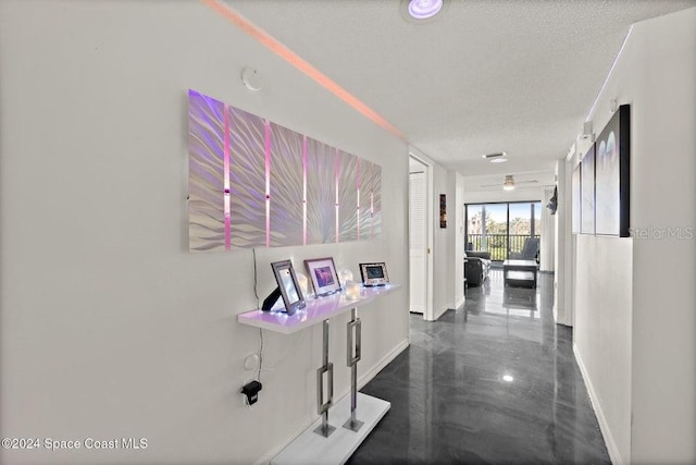 hallway featuring a textured ceiling