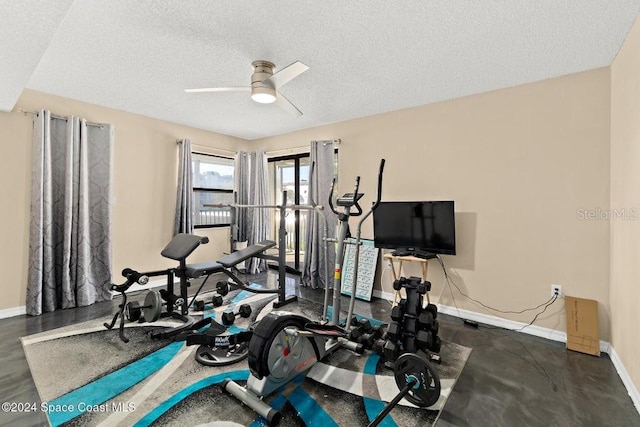 workout area with a textured ceiling and ceiling fan