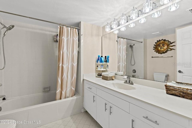 full bathroom with shower / tub combo, vanity, toilet, and tile patterned floors