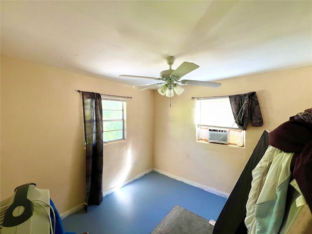 empty room with ceiling fan, cooling unit, and concrete flooring