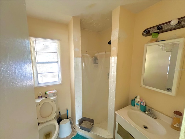 bathroom with vanity, toilet, and curtained shower