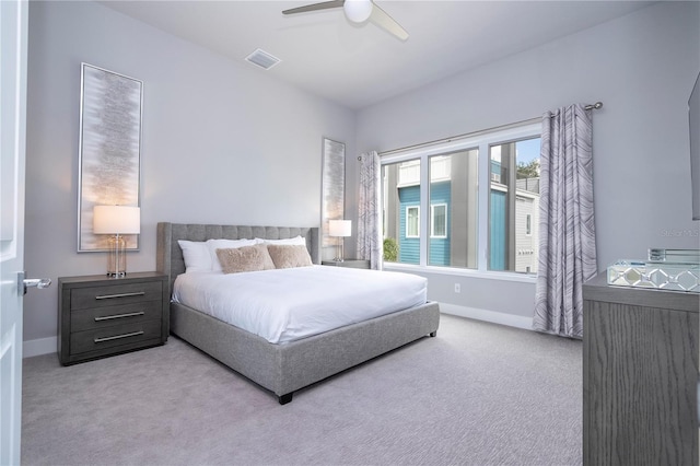 bedroom with light carpet and ceiling fan