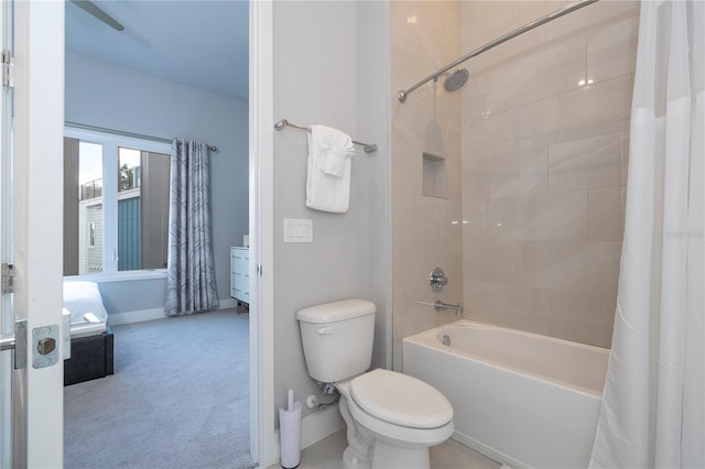 bathroom featuring toilet and shower / tub combo