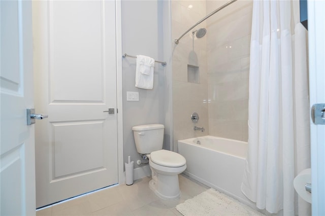 bathroom featuring tile patterned flooring, toilet, and shower / bath combo