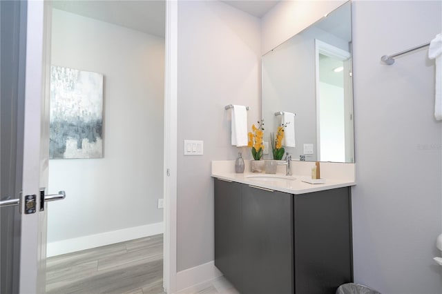 bathroom with vanity and hardwood / wood-style floors