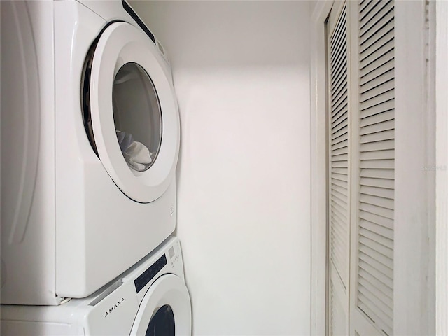 laundry room featuring stacked washer and clothes dryer