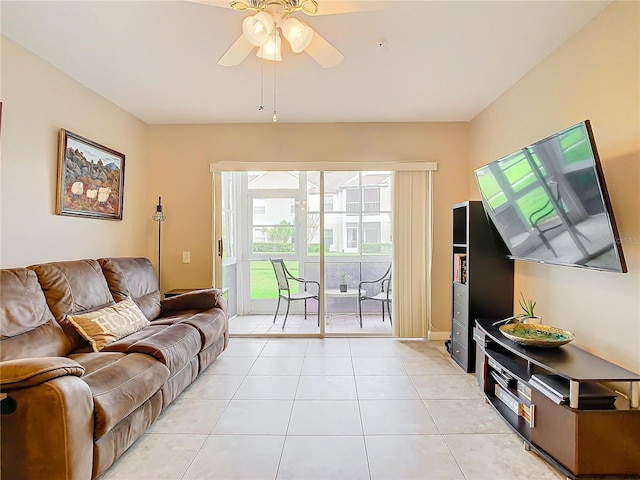 living room featuring ceiling fan and light tile patterned floors