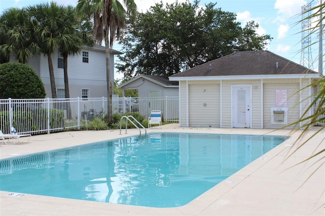 view of pool featuring a patio area and an outdoor structure