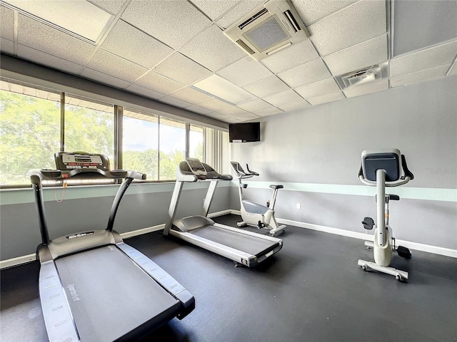 gym featuring a paneled ceiling