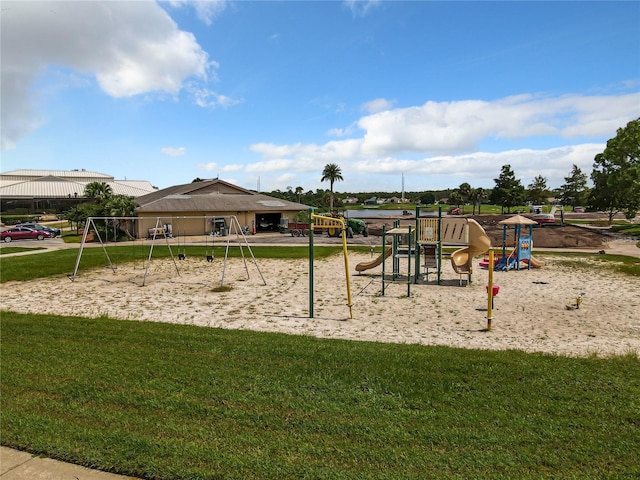 view of jungle gym featuring a lawn