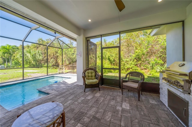 sunroom featuring a swimming pool