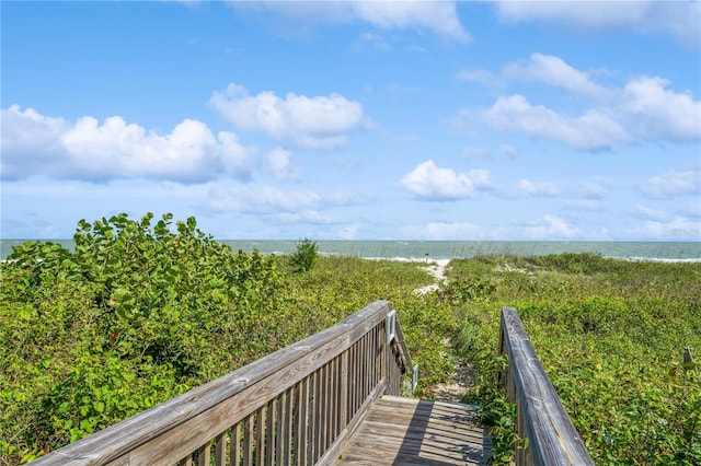 view of property's community featuring a view of the beach and a water view