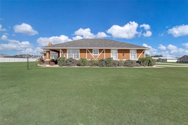 ranch-style home featuring a front yard