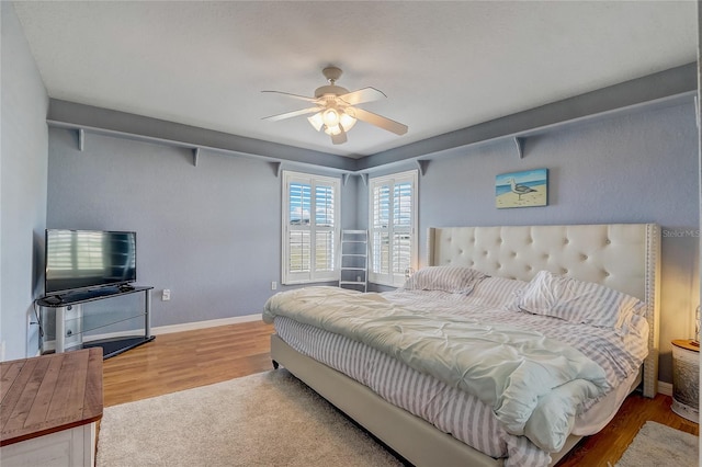 bedroom featuring ceiling fan and hardwood / wood-style floors