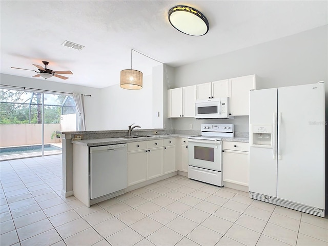 kitchen featuring pendant lighting, white appliances, sink, ceiling fan, and white cabinetry