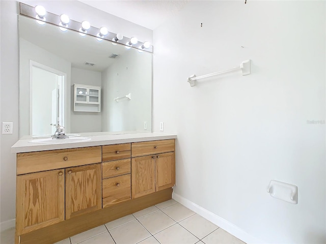 bathroom featuring tile patterned flooring and vanity