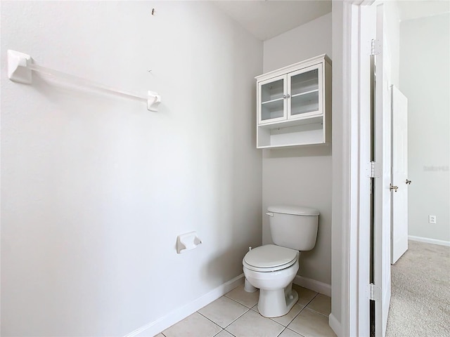 bathroom featuring tile patterned flooring and toilet