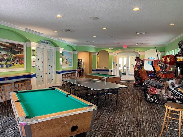 rec room with french doors, ornamental molding, a textured ceiling, pool table, and decorative columns