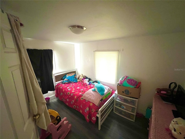 bedroom featuring dark wood-type flooring