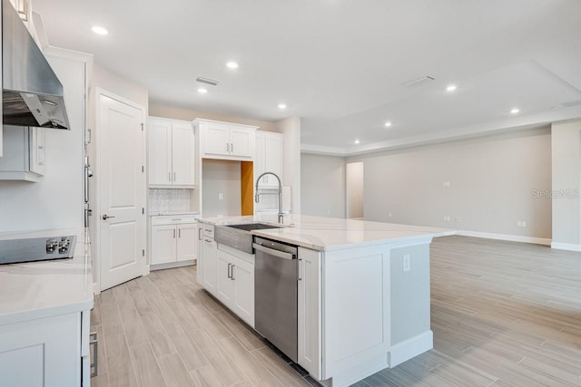 kitchen featuring sink, stainless steel dishwasher, ventilation hood, a center island with sink, and white cabinets